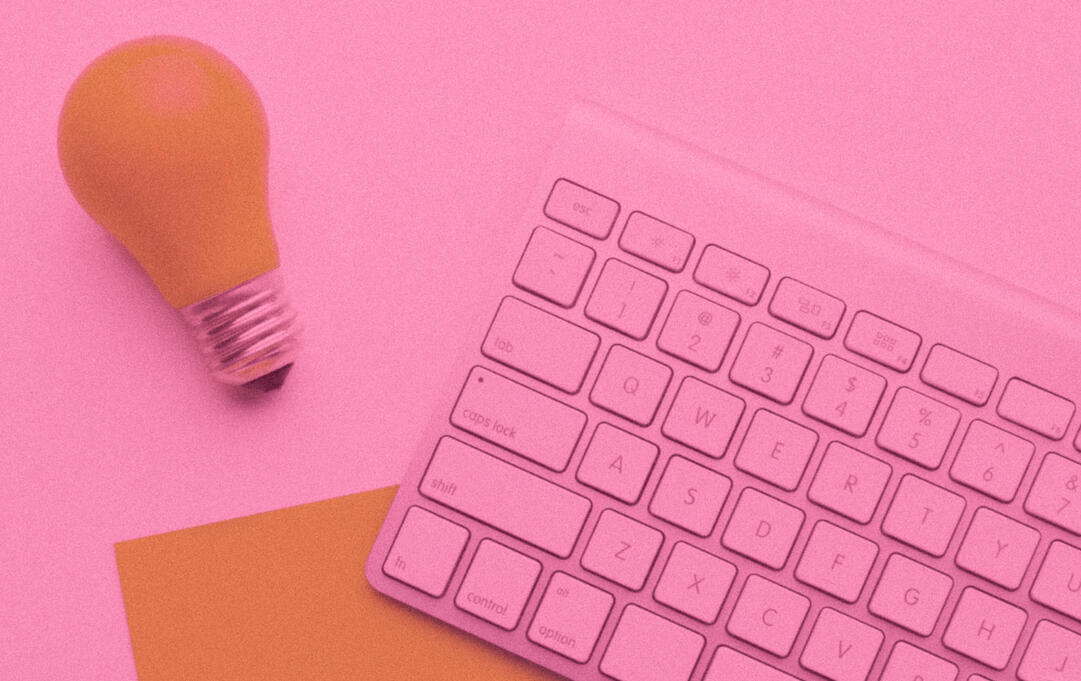 a lightbulb and keyword on a desk