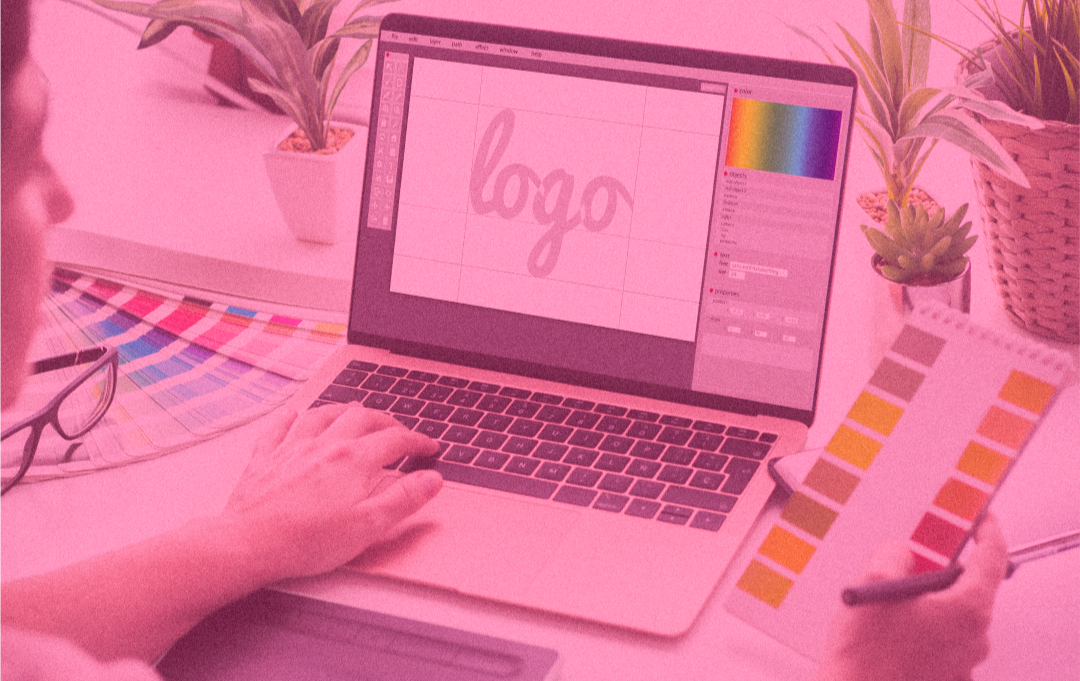 a person working on a logo design on their laptop